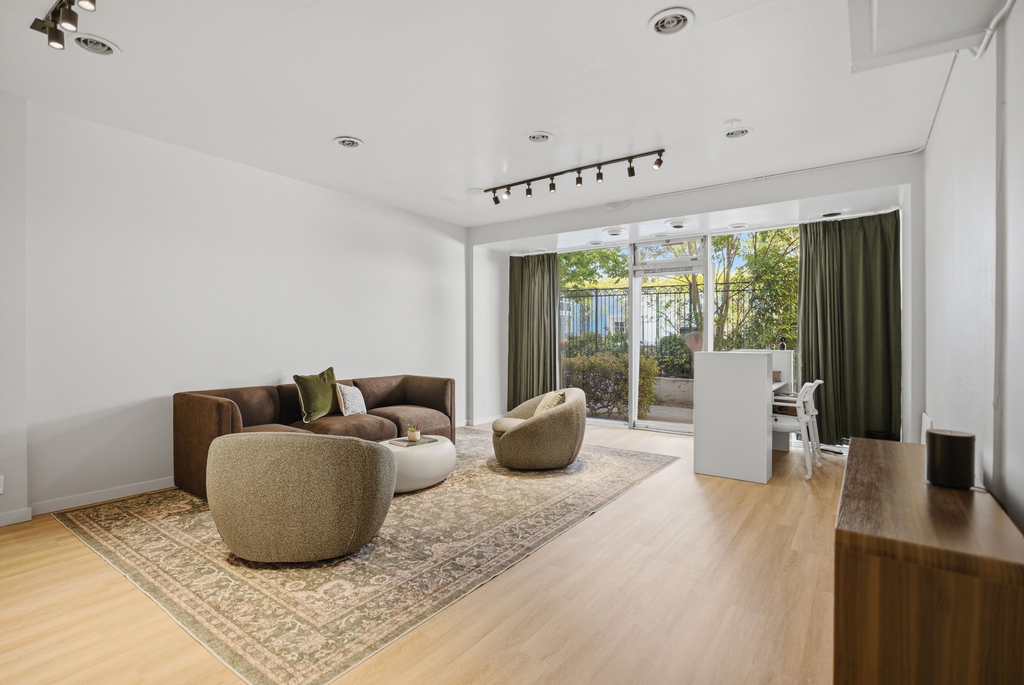 Open event space with seating area and hallway view