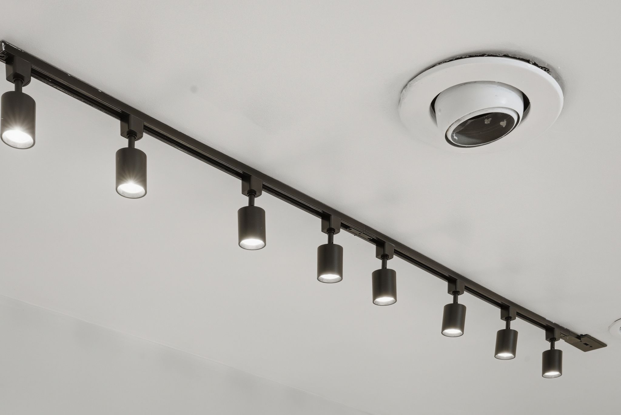 Track lighting fixtures on ceiling